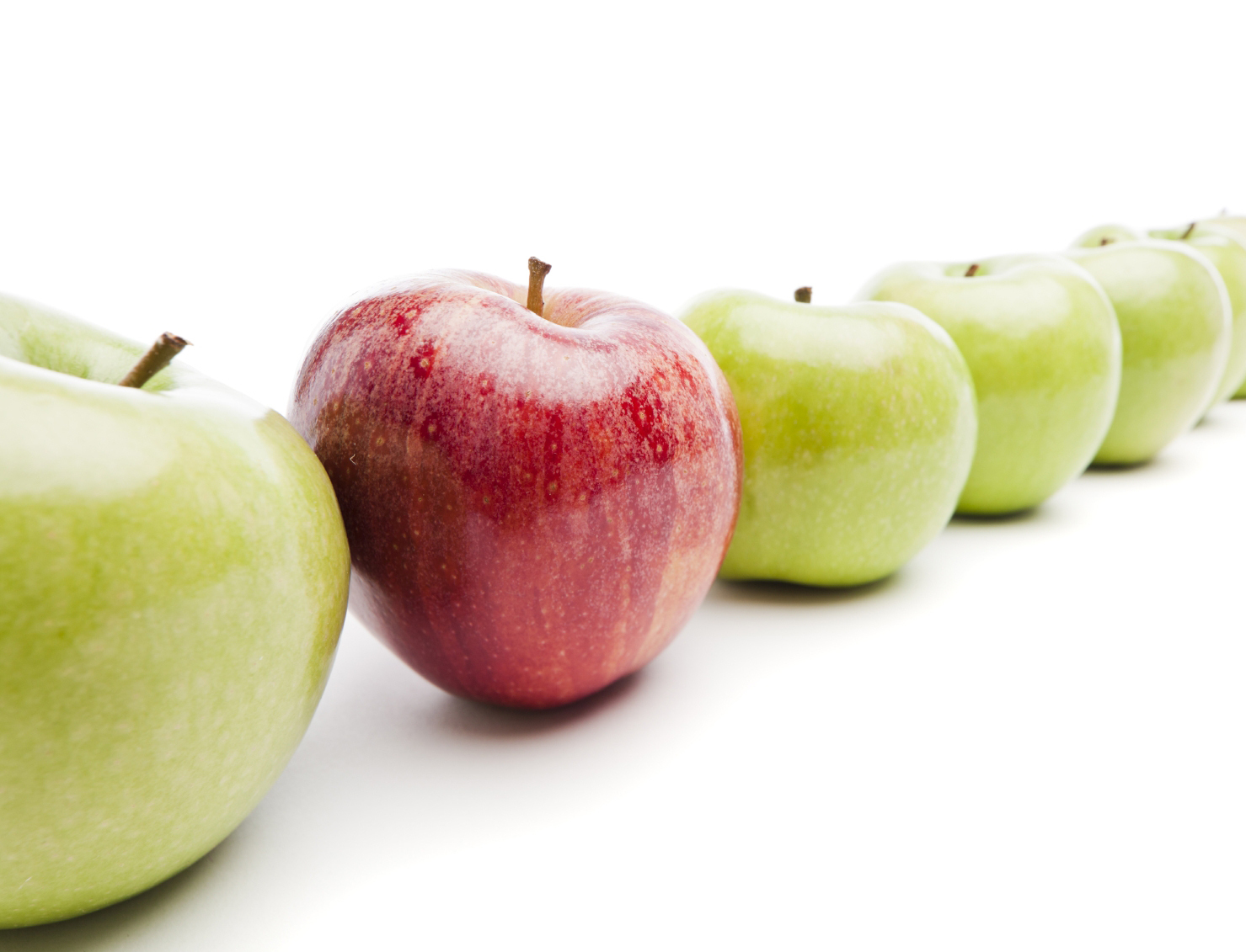 Red Royal Gala apple among Granny Smith green apples